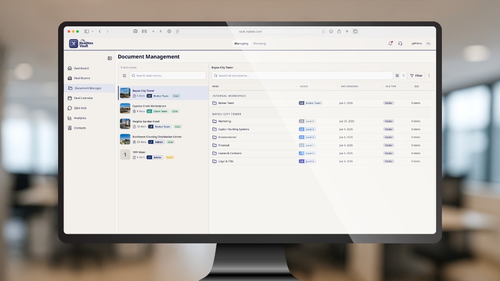 RealNex Vault Document Management on a desktop monitor, showing deal rooms and project folders with role-based access levels